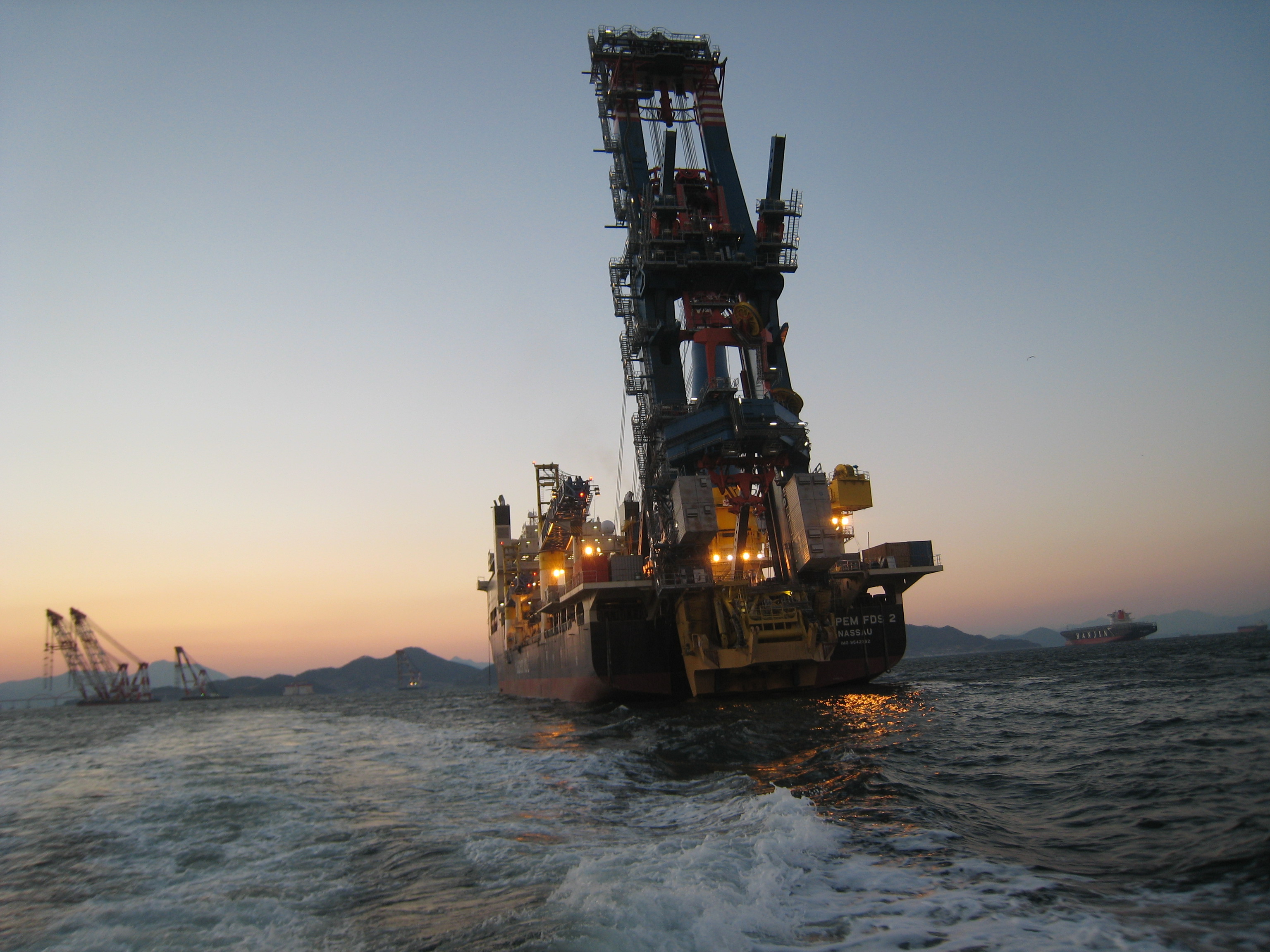 Pipe lay vessel at anchor against sunset